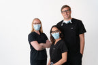 Three people wearing SLEEVZ masks with their glasses