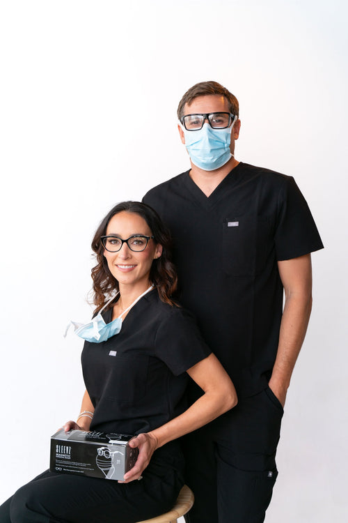 Two people with a box of SLEEVZ disposable masks