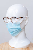SLEEVZ disposable mask attached to eyeglasses on a display head